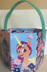 Size: 2157x3256 | Tagged: safe, derpibooru import, izzy moonbow, sunny starscout, g5, basket, box, easter basket, front view, image, jpeg, panorama, patterned background