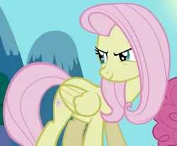 Size: 683x562 | Tagged: safe, derpibooru import, screencap, fluttershy, pegasus, pony, season 2, the return of harmony, cropped, discorded, female, flutterbitch, fluttercruel, folded wings, g4, image, looking back, mare, offscreen character, png, smiling, solo focus, standing, wings