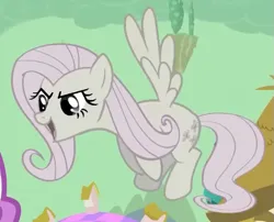 Size: 573x462 | Tagged: safe, derpibooru import, screencap, fluttershy, pegasus, pony, season 2, the return of harmony, cropped, discorded, female, flutterbitch, fluttercruel, flying, g4, image, looking at someone, mare, offscreen character, open mouth, open smile, png, smiling