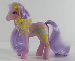 Size: 746x600 | Tagged: safe, derpibooru import, spring song, earth pony, pony, g1, bow, ear piercing, earring, female, hair bow, image, irl, jewelry, jpeg, photo, piercing, solo, standing, sweetheart sister ponies