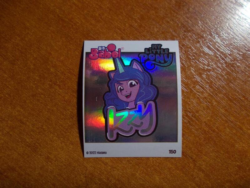 Size: 1024x768 | Tagged: safe, derpibooru import, official, izzy moonbow, unicorn, g5, 2d, happy, horn, image, indonesian, jpeg, logo, looking at you, merchandise, photo, shiny, smiling, smiling at you, sticker