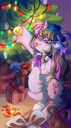 Size: 1432x2560 | Tagged: safe, artist:vanilla-chan, derpibooru import, octavia melody, pony, unicorn, christmas, christmas lights, christmas tree, cute, eye clipping through hair, eyebrows, eyebrows visible through hair, female, floppy ears, fluffy, g4, holiday, hoof hold, horn, image, indoors, jpeg, looking up, mare, present, race swap, signature, solo, standing on two hooves, tavibetes, tongue out, tree