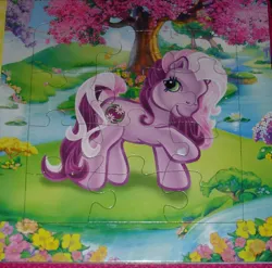 Size: 800x791 | Tagged: safe, derpibooru import, official, earth pony, g3, 2d, book, egmont, flower, image, jpeg, lake, looking at you, page, photo, puzzle, raised hoof, smiling, smiling at you, standing, tree, water, waterlily