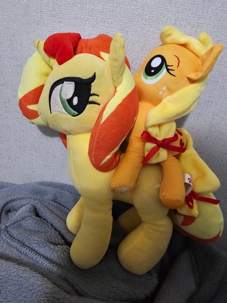 Size: 3000x4000 | Tagged: safe, derpibooru import, photographer:professorventurer, applejack, sunset shimmer, pony, appletini, image, jpeg, micro, plushie, ponies riding ponies, riding