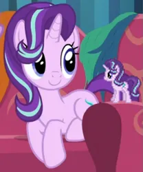 Size: 505x607 | Tagged: safe, derpibooru import, screencap, starlight glimmer, pony, unicorn, it isn't the mane thing about you, april fools 2024, behaving like a cat, couch, cropped, cute, desktop ponies, female, g4, glimmerbetes, hair over one eye, horn, image, mare, pixel art, png, self paradox, self ponidox, sitting, smiling, solo, sprite