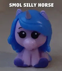 Size: 1203x1374 | Tagged: safe, derpibooru import, izzy moonbow, pony, unicorn, g5, caption, horn, image, irl, jpeg, merchandise, pencil topper, photo, text, toy