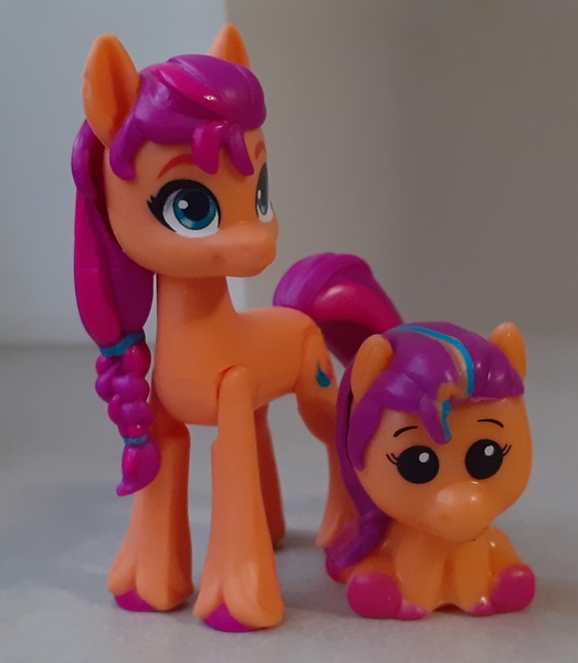 Size: 1621x1859 | Tagged: safe, derpibooru import, sunny starscout, earth pony, pony, g5, comparison, horn, image, irl, jpeg, mane stripe sunny, merchandise, pencil topper, photo, self paradox, self ponidox, toy