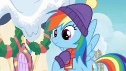 Size: 1200x675 | Tagged: safe, derpibooru import, screencap, rainbow dash, pegasus, pony, best gift ever, candle, clothes, cute, dashabetes, female, flying, g4, hat, image, jpeg, mare, scarf, smiling, solo, winter outfit