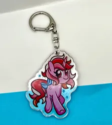 Size: 2250x2518 | Tagged: safe, artist:redpalette, derpibooru import, galaxy (g1), unicorn, g1, bow, horn, image, jpeg, keychain, looking at you, merchandise, photo, smiling