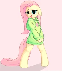 Size: 866x1000 | Tagged: safe, artist:apony, derpibooru import, fluttershy, pony, semi-anthro, bipedal, blushing, clothes, floppy ears, g4, hoodie, image, pink background, png, simple background, smiling, solo