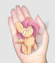 Size: 1997x2280 | Tagged: safe, artist:miryelis, derpibooru import, fluttershy, pegasus, pony, crying, cute, disembodied hand, full body, hand, image, in goliath's palm, meme, micro, png, sitting, size difference, small pony, smol, solo