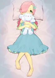 Size: 2894x4093 | Tagged: safe, artist:dekasuji, derpibooru import, fluttershy, human, equestria girls, bed, blushing, clothes, dress, g4, hug, image, looking at you, lying down, on back, pillow, plushie, png, solo, younger
