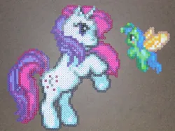 Size: 600x448 | Tagged: safe, artist:sparksparkles, derpibooru import, moondancer (g1), unnamed character, breezie, pony, unicorn, g1, g3, craft, horn, image, jpeg, my little pony: pinkie pie's party, perler beads, rearing, unnamed breezie