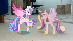 Size: 4032x2268 | Tagged: safe, derpibooru import, princess cadance, princess flurry heart, alicorn, 3d, 3d model, adult flurry heart, augmented reality, chair, crown, duo, female, funko, g4, gameloft, hoof shoes, image, irl, jewelry, jpeg, mother and child, mother and daughter, my little pony: magic princess, older, older flurry heart, peytral, photo, raised hoof, regalia, rug, spread wings, toy, wings