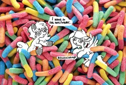 Size: 2342x1590 | Tagged: safe, artist:opalacorn, derpibooru import, oc, unofficial characters only, earth pony, pegasus, pony, candy, chest fluff, coat markings, commission, dialogue, duo, eating, female, food, gummy worm, image, irl, jpeg, mare, photo, ponies in food, ponies in real life, speech bubble, tiny, tiny ponies, unshorn fetlocks