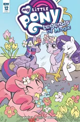 Size: 2063x3131 | Tagged: safe, artist:meaghan carter, derpibooru import, idw, pinkie pie, rarity, twilight sparkle, twilight sparkle (alicorn), alicorn, earth pony, pony, unicorn, comic cover, cover, cover art, eyes closed, female, floral head wreath, floral necklace, flower, folded wings, g4, horn, image, legends of magic #12, looking at mirror, mare, mirror, mouth hold, my little pony logo, my little pony: legends of magic, official comic, png, trio, trio female, variant cover, wings