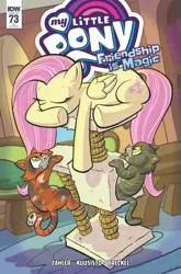 Size: 2063x3131 | Tagged: safe, artist:thom zahler, derpibooru import, idw, fluttershy, cat, pegasus, pony, g4, spoiler:comic, spoiler:comic73, behaving like a cat, cat tower, cat tree, comic cover, cover, cover art, eyes closed, fluttershy's cottage, folded wings, image, indoors, jpeg, lying down, my little pony logo, official comic, prone, tail, underhoof, variant cover, wings