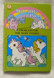 Size: 651x945 | Tagged: safe, derpibooru import, official, baby moondancer, baby surprise, firefly, glory, dragonfly, insect, pegasus, pony, unicorn, g1, baby, baby pony, book, book cover, bow, cover, female, filly, foal, horn, image, jpeg, mare, tail, tail bow