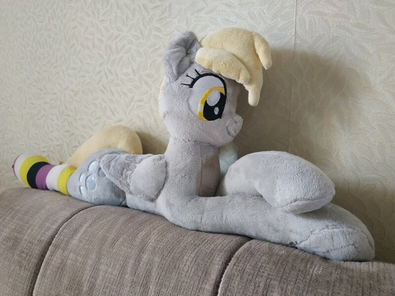 Size: 1080x810 | Tagged: safe, artist:percypawz, derpibooru import, derpy hooves, pegasus, pony, clothes, couch, crossed hooves, female, image, jpeg, lying down, mare, nonbinary, nonbinary pride flag, photo, plushie, pride, pride flag, socks, toy