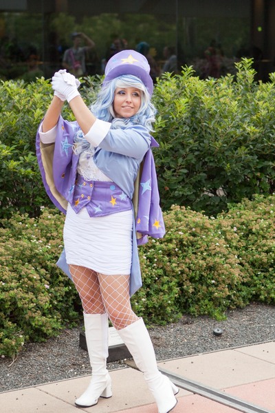 Size: 2087x3131 | Tagged: safe, artist:mieucosplay, derpibooru import, trixie, human, bronycon, bronycon 2014, g4, boots, bush, cape, clothes, cosplay, costume, fishnet pantyhose, hat, high heel boots, image, irl, irl human, jpeg, outdoors, photo, pose, reflection, shoes, smiling, top hat, trixie's cape, wig, window