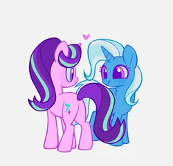 Size: 2048x1969 | Tagged: safe, artist:delzol, derpibooru import, starlight glimmer, trixie, pony, unicorn, g4, blue sclera, butt, colored eyelashes, colored sclera, cute, diatrixes, female, floating heart, glimmerbetes, grin, hair over one eye, heart, horn, image, jpeg, lesbian, looking at each other, looking at someone, plot, purple eyelashes, shipping, simple background, smiling, smiling at each other, standing, startrix