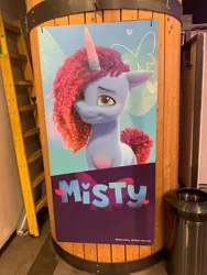 Size: 450x600 | Tagged: safe, derpibooru import, butterfly, insect, pony, unicorn, g5, colored belly, cute, daaaaaaaaaaaw, female, horn, image, israel, jpeg, looking at you, mare, misty brightdawn, my little pony cafe, name, rebirth misty, sign, smiling