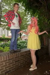 Size: 684x1024 | Tagged: safe, derpibooru import, big macintosh, fluttershy, human, 2015, brick wall, clothes, cosplay, costume, cutie mark, cutie mark on clothes, denim, dress, duo, duo male and female, female, floral head wreath, flower, fluttermac, hand on hip, holding hands, image, irl, jeans, jpeg, looking at you, male, outdoors, pants, photo, plaid shirt, shipping, shirt, shoes, shrug, straight, t-shirt, tree, wig, wings