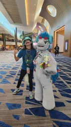 Size: 900x1599 | Tagged: safe, artist:springbear452_, derpibooru import, oc, oc:the living tombstone, earth pony, human, 2023, clothes, cosplay, costume, duo, fursuit, headphones, image, indoors, irl, irl human, jpeg, megaplex, photo, ponysuit