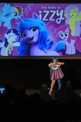 Size: 4149x6223 | Tagged: safe, derpibooru import, izzy moonbow, human, g5, 2021, clothes, convention, cosplay, costume, cyrillic, image, irl, irl human, jpeg, newbronycon, photo, rubronycon, russian