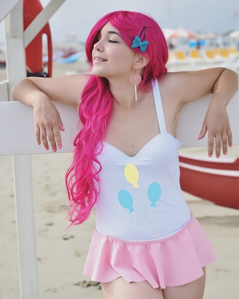 Size: 2160x2700 | Tagged: safe, derpibooru import, pinkie pie, human, g4, armpits, bare shoulders, beach, clothes, cosplay, costume, cutie mark, cutie mark on clothes, high res, image, irl, irl human, jpeg, nail polish, one-piece swimsuit, photo, sleeveless, swimsuit