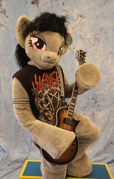 Size: 817x1280 | Tagged: safe, artist:atalonthedeer, derpibooru import, octavia melody, anthro, earth pony, human, pony, g4, 2015, arm hooves, bedroom eyes, clothes, cosplay, costume, electric guitar, female, fursuit, guitar, hooves, image, irl, irl human, jpeg, les paul, looking at you, musical instrument, photo, ponysuit, pose, shirt, slayer, smiling, solo, t-shirt, thrash metal