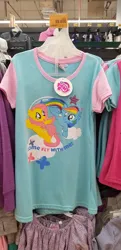 Size: 2752x5664 | Tagged: safe, derpibooru import, fluttershy, rainbow dash, pegasus, pony, g4, clothes, duo, female, image, irl, jpeg, mare, merchandise, my little pony logo, open mouth, open smile, photo, shirt, smiling, spread wings, t-shirt, text, wings