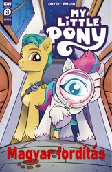 Size: 1991x3060 | Tagged: safe, derpibooru import, edit, idw, hitch trailblazer, zipp storm, earth pony, pegasus, pony, g5, spoiler:comic, spoiler:g5comic, spoiler:g5comic03, comic cover, hungarian, image, language: hungarian, magnifying glass, male, paw prints, png, stallion, translation, translator:zsiguel