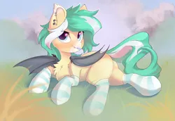 Size: 2900x1992 | Tagged: safe, artist:kebchach, derpibooru import, oc, oc:icy breeze, unofficial characters only, bat pony, pony, bat pony oc, bat wings, chest fluff, clothes, ear piercing, earring, fangs, female, grass, high res, image, jewelry, looking at you, lying down, mare, one wing out, piercing, png, socks, solo, striped socks, tail, tongue out, wings