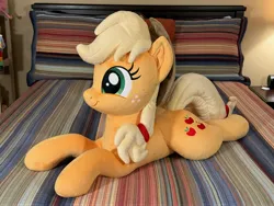 Size: 4032x3024 | Tagged: safe, artist:littlefairyswonders, derpibooru import, applejack, earth pony, pony, g4, applejack's hat, bed, cowboy hat, female, hat, image, irl, jpeg, lying down, photo, plushie, solo