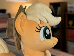 Size: 4032x3024 | Tagged: safe, artist:littlefairyswonders, derpibooru import, applejack, earth pony, pony, g4, applejack's hat, cowboy hat, female, hat, image, irl, jpeg, lying down, photo, plushie, solo