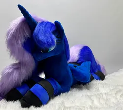 Size: 1280x1150 | Tagged: safe, artist:melodis, derpibooru import, princess luna, alicorn, pony, g4, clothes, folded wings, image, irl, jpeg, lying down, photo, plushie, prone, socks, solo, striped socks, wings