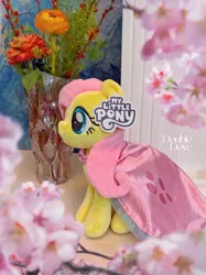 Size: 3835x5114 | Tagged: safe, derpibooru import, edit, official, fluttershy, pegasus, pony, g4, cape, clothes, double dove, dress, flower, image, indoors, irl, jpeg, merchandise, outfit, photo, plushie, pony plushie, reesee, solo, text, vase