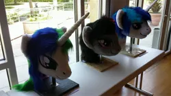 Size: 4128x2322 | Tagged: safe, artist:atalonthedeer, derpibooru import, octavia melody, princess celestia, shining armor, g4, 2013, disembodied head, fursuit head, galacon, image, irl, jpeg, photo, ponysuit, table, trio