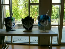 Size: 4000x3000 | Tagged: safe, artist:atalonthedeer, derpibooru import, octavia melody, princess celestia, shining armor, g4, 2013, disembodied head, fursuit head, galacon, image, irl, jpeg, photo, ponysuit, table, trio