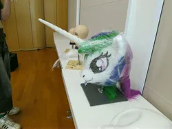 Size: 4000x3000 | Tagged: safe, artist:atalonthedeer, derpibooru import, princess celestia, g4, 2013, disembodied head, fursuit head, galacon, image, irl, jpeg, photo, ponysuit, table, trio