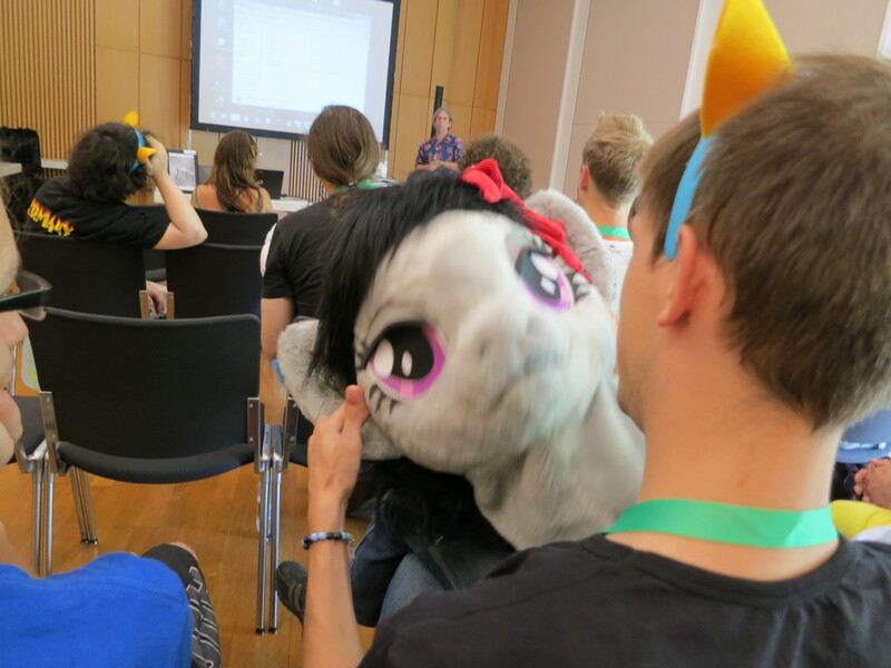 Size: 4000x3000 | Tagged: safe, artist:atalonthedeer, derpibooru import, octavia melody, human, g4, 2013, disembodied head, fursuit head, galacon, image, irl, irl human, jpeg, photo, ponysuit, table