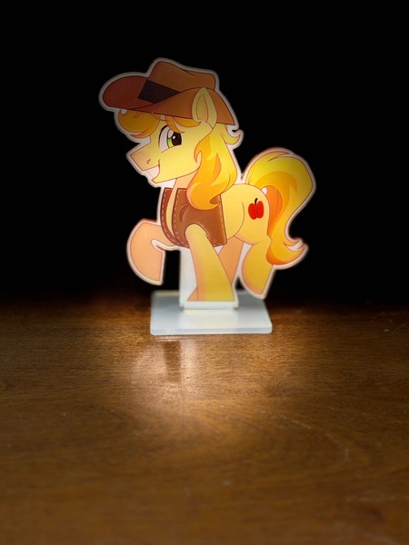 Size: 3024x4032 | Tagged: safe, artist:slushpony, derpibooru import, braeburn, pony, g4, image, jpeg, looking at you, male, photo, smiling, solo, solo male, stage light, stallion, standee, two toned mane