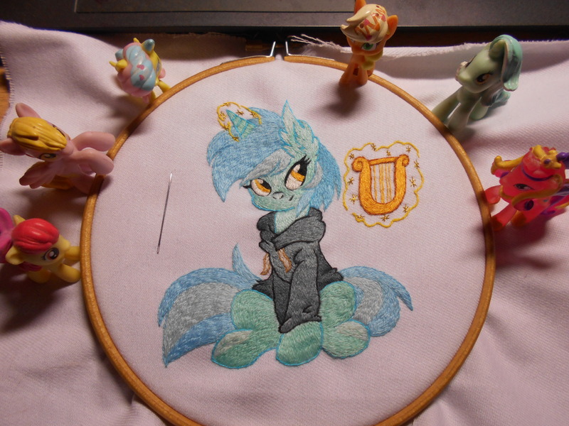 Size: 5152x3864 | Tagged: safe, artist:ambris, artist:lightdragon1988, derpibooru import, lyra heartstrings, pony, unicorn, g4, clothes, dig the swell hoodie, ear fluff, embroidery, hoodie, horn, image, irl, jpeg, lyre, magic, magic aura, musical instrument, photo, sitting, smiling, telekinesis, toy