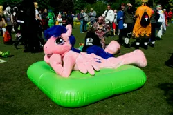 Size: 4608x3072 | Tagged: safe, artist:atalonthedeer, derpibooru import, firefly, g1, connichi, fursuit, image, inflatable mattress, jpeg, lying down, mattress, outdoors, ponysuit, prone, solo focus