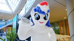 Size: 1191x671 | Tagged: safe, artist:losttelly, artist:sgsuits, derpibooru import, oc, oc:britannia (uk ponycon), bust, fursuit, image, irl, jpeg, photo, ponysuit, portrait, solo, waving