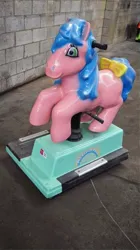 Size: 493x880 | Tagged: safe, derpibooru import, starlight (g1), earth pony, pony, g1, blue hair, blue mane, blue tail, bow, closed mouth, cute, female, green eyes, image, jolly roger amusement rides, jpeg, kiddie ride, mare, outdoors, pink coat, smiling, solo, stawwlight, tail, tail bow, yellow bow