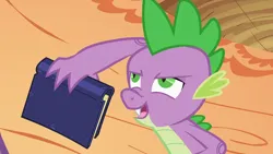 Size: 1920x1080 | Tagged: safe, derpibooru import, screencap, spike, dragon, g4, season 2, secret of my excess, book, golden oak library, greed spike, holding a book, image, indoors, library, male, my little pony, older, older spike, png, solo, teenage spike, teenaged dragon, teenager