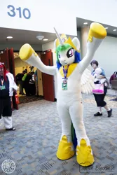 Size: 1500x2250 | Tagged: safe, artist:atalonthedeer, derpibooru import, princess celestia, human, bronycon, g4, 2018, fursuit, image, indoors, irl, irl human, jewelry, jpeg, photo, ponysuit, raised arms, regalia, solo focus